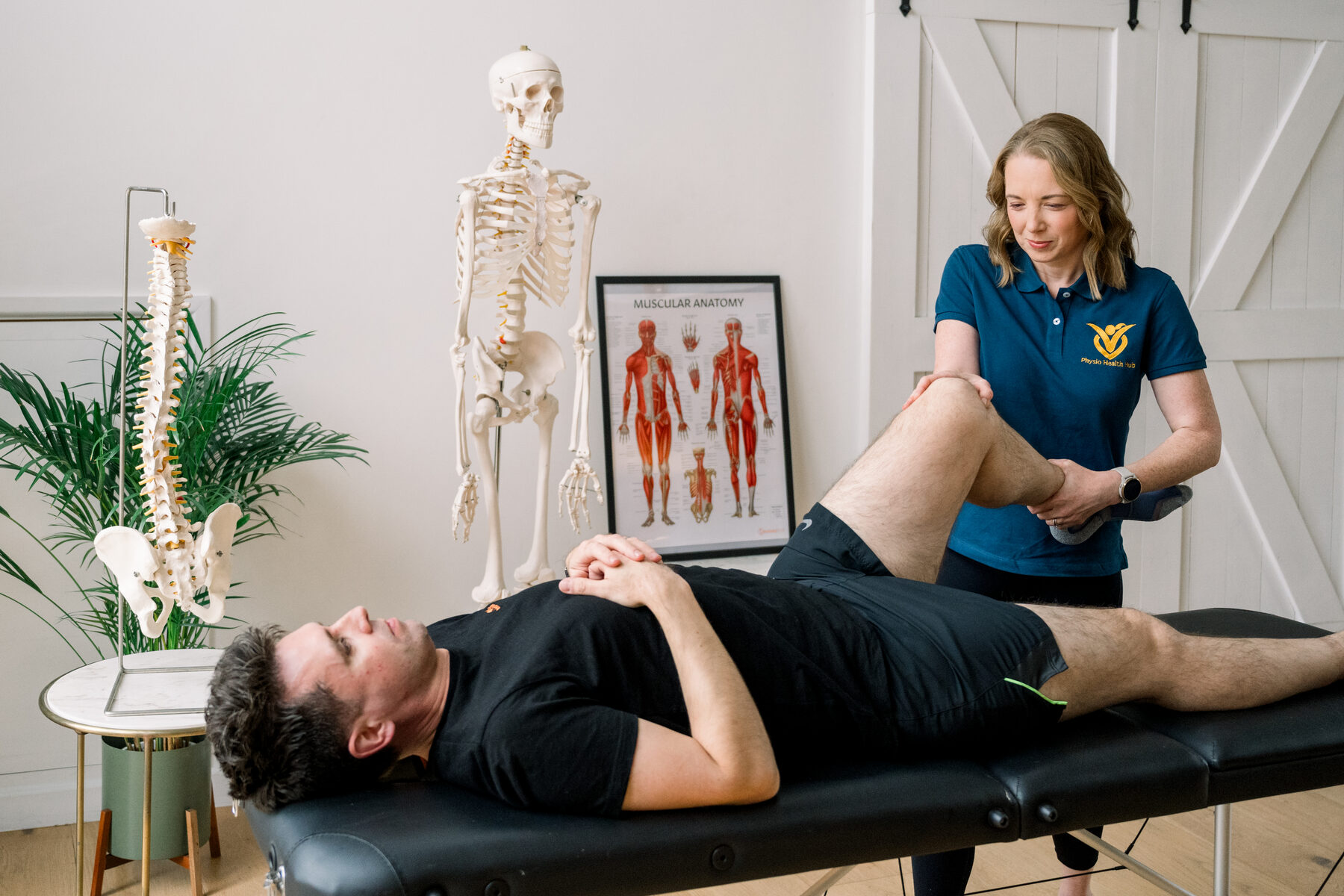 Physiotherapist treating a patient at Physio Health Hub
