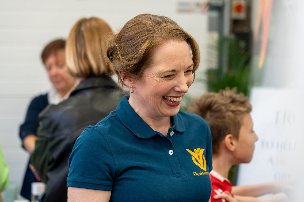 Vicky Sharpe talking with patients of all ages at a Physio Health Hub open day